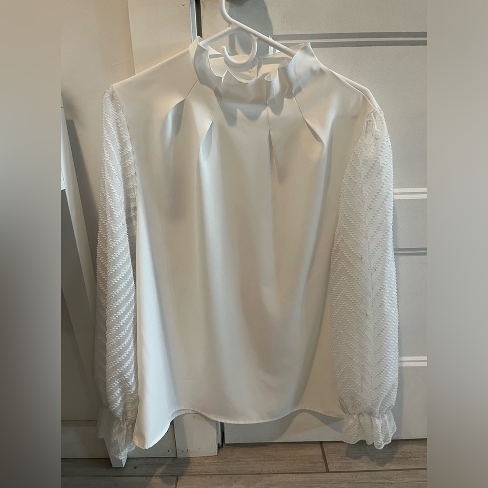 NWOT White blouse. Sheer sleeves.